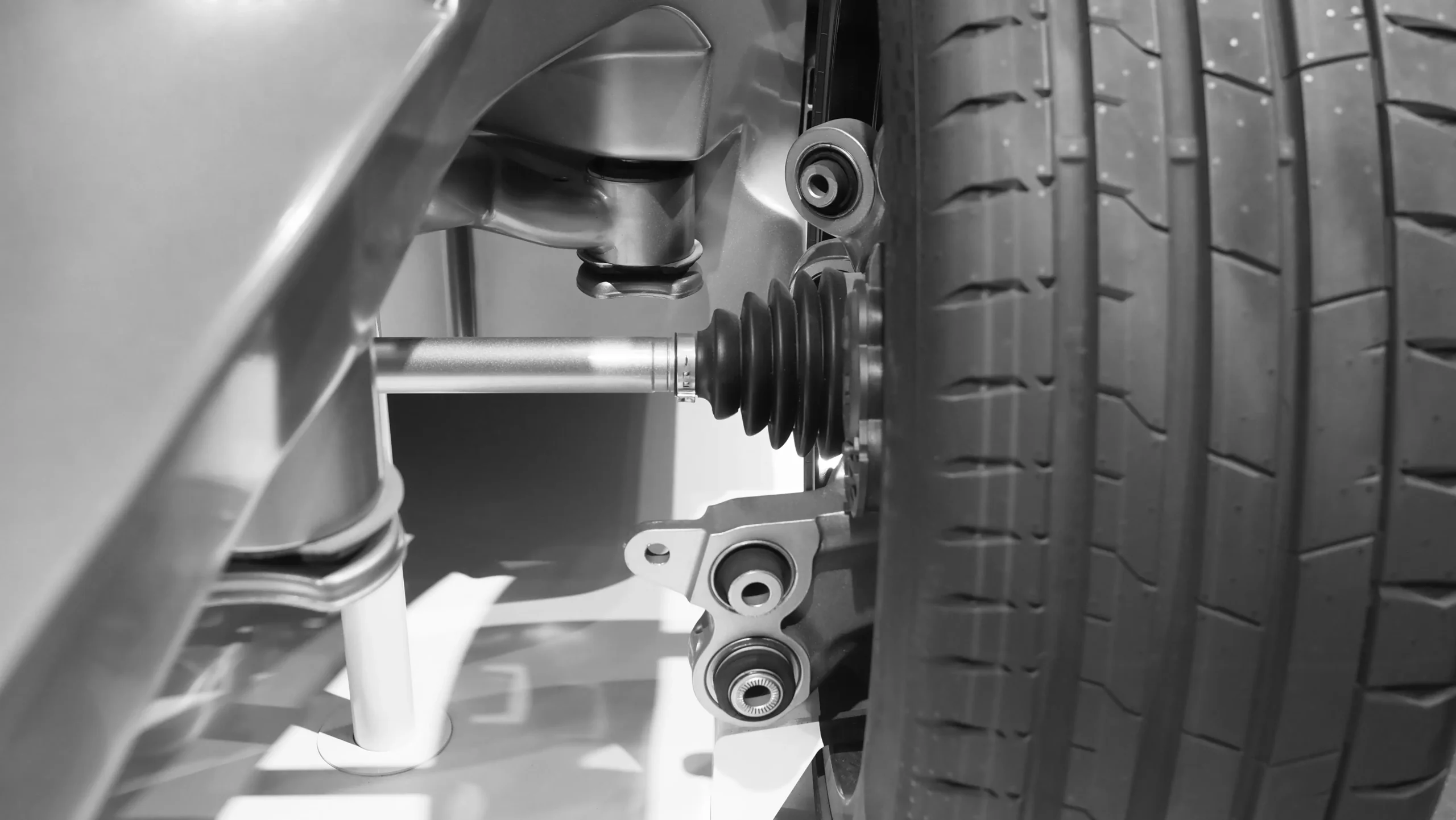 a-vehicle-s-suspension-system-and-tire-black-and-w-2025-07-09-09-43-55-utc