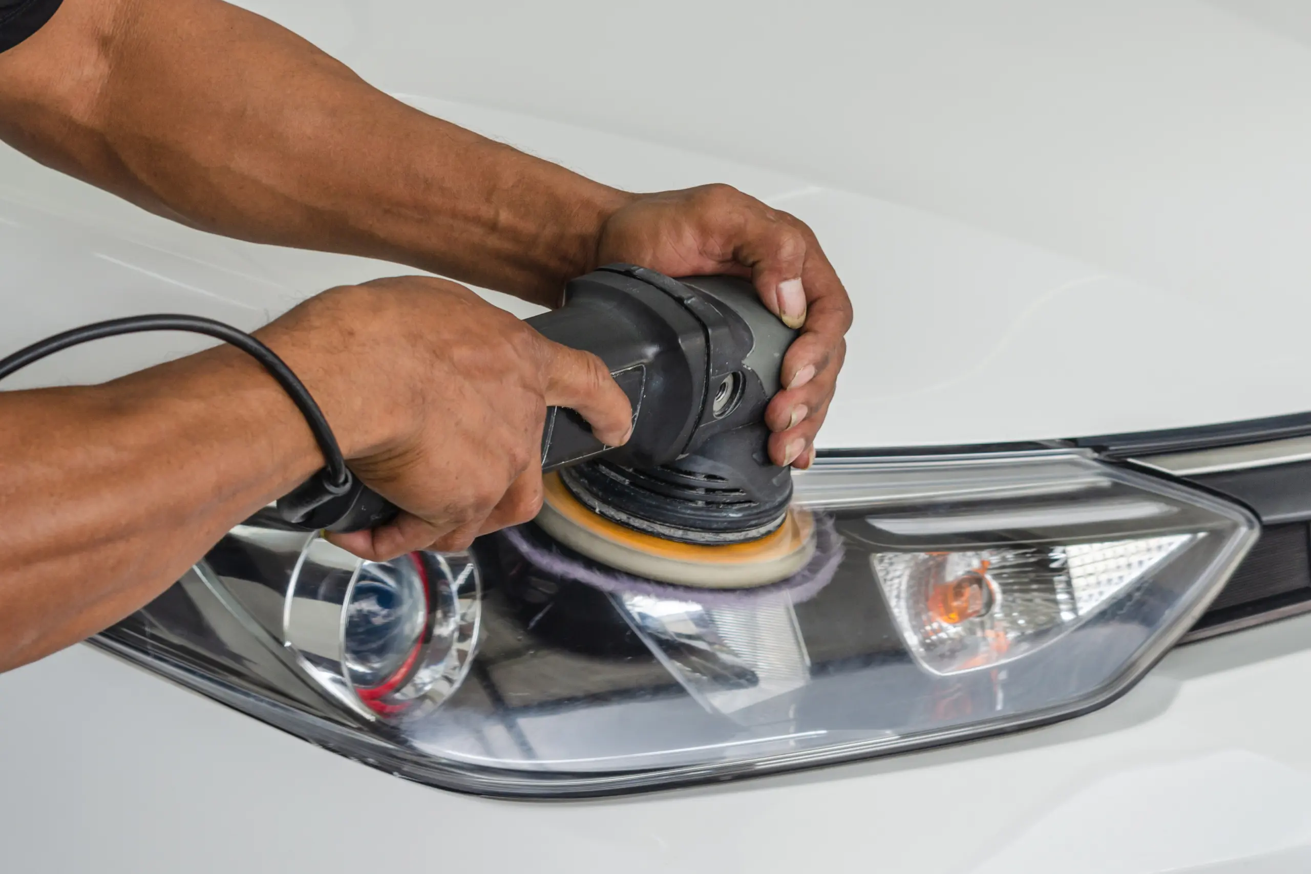 auto-detailing-car-headlight-and-polishing
