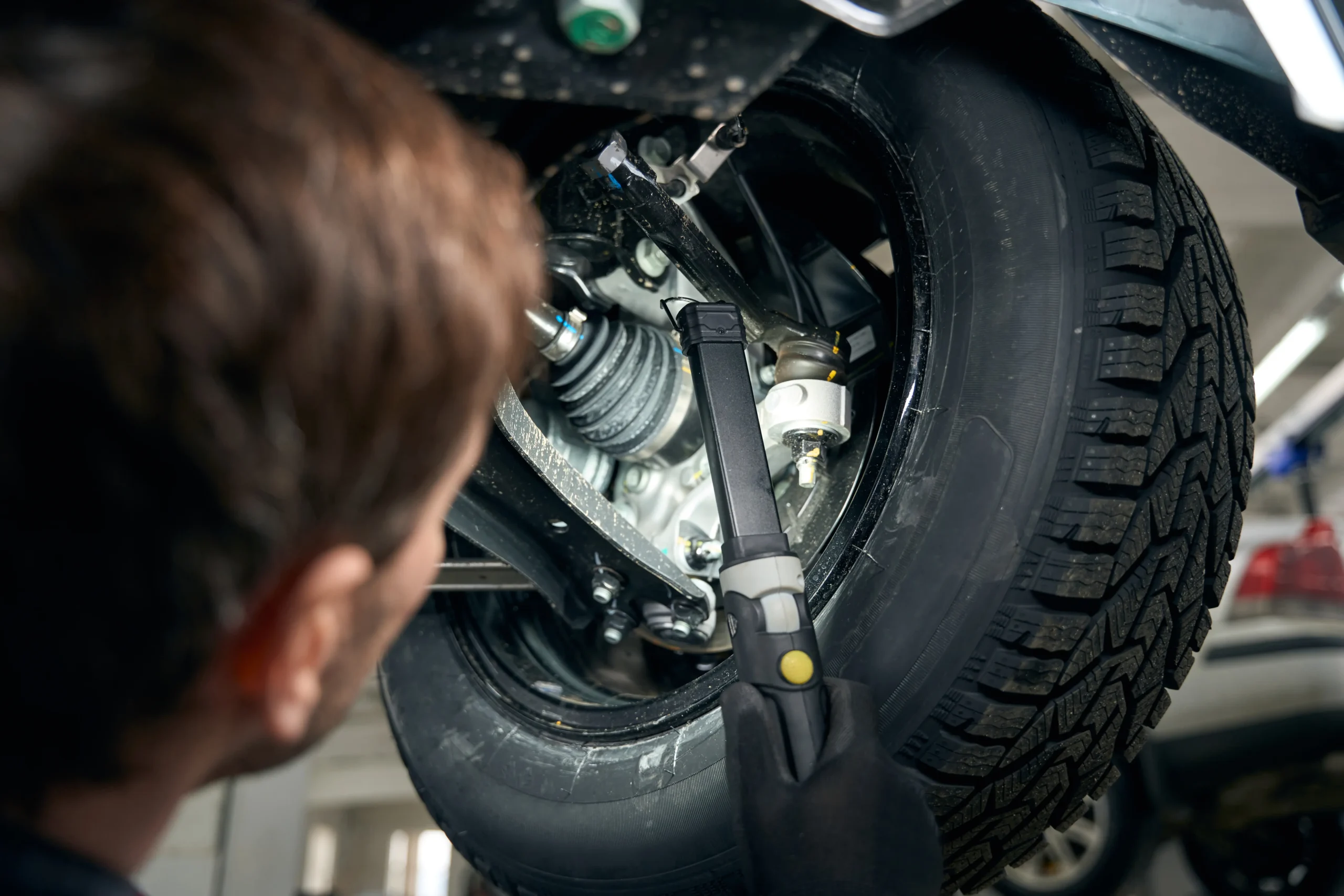 man-checking-boot-collars-in-the-workshop-2025-03-08-23-23-41-utc